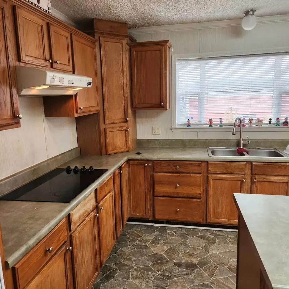 The same kitchen before refinishing, honey oak doors and drawer fronts throughout