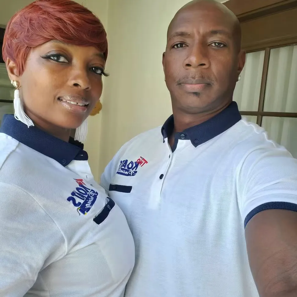 Two Koats Painting owners on site in branded company polo shirts