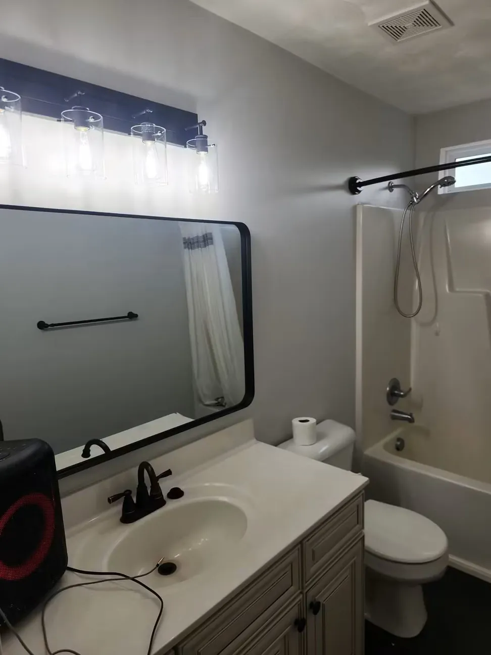 Bathroom finished in gray with the vanity refinished to match