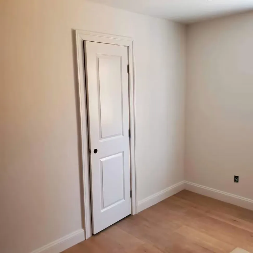 New-build bedroom finished, walls flat and even and the door, casing and baseboard cut in