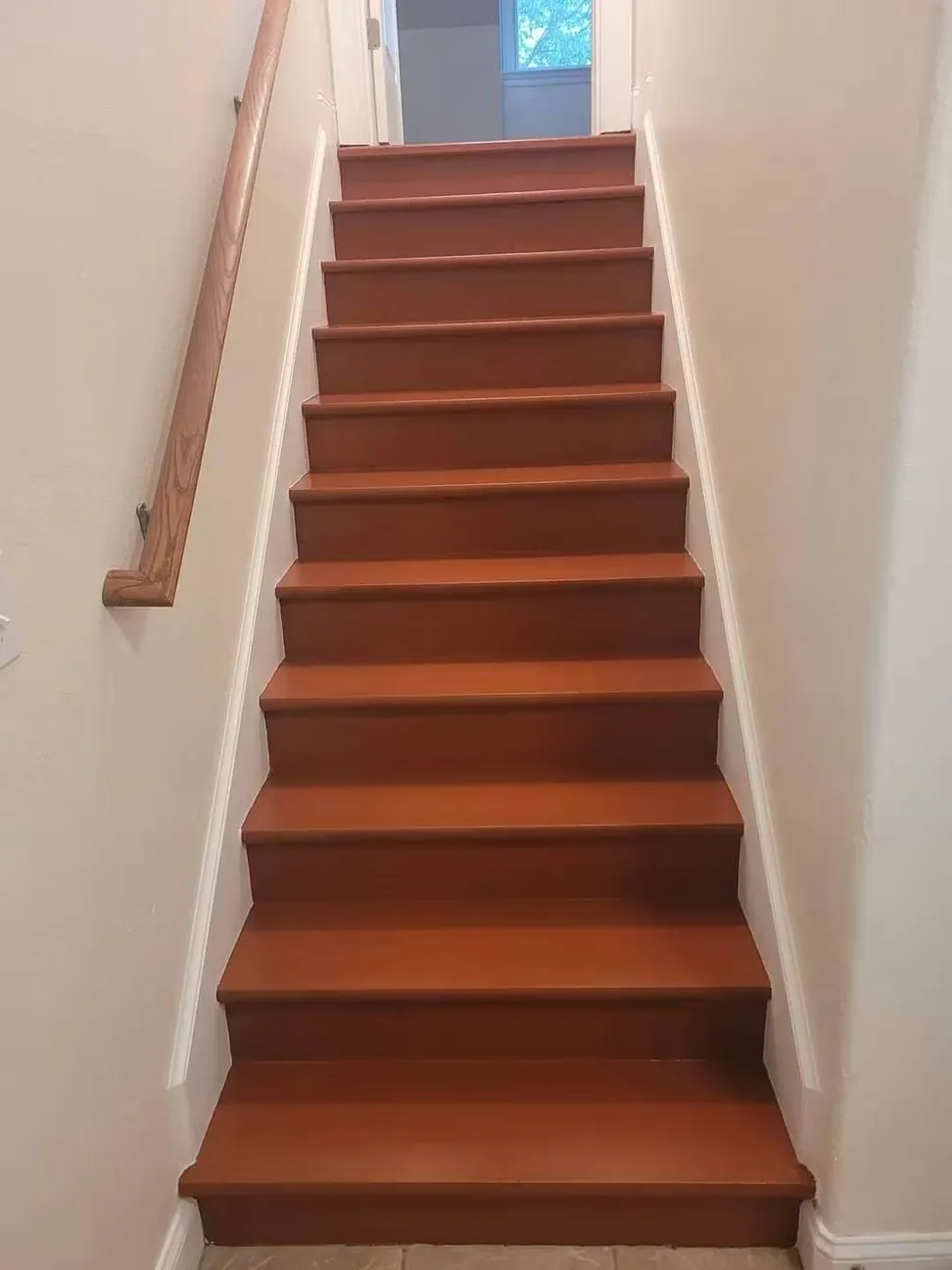 Staircase after the treads were stained and finished, the risers and stringers left white